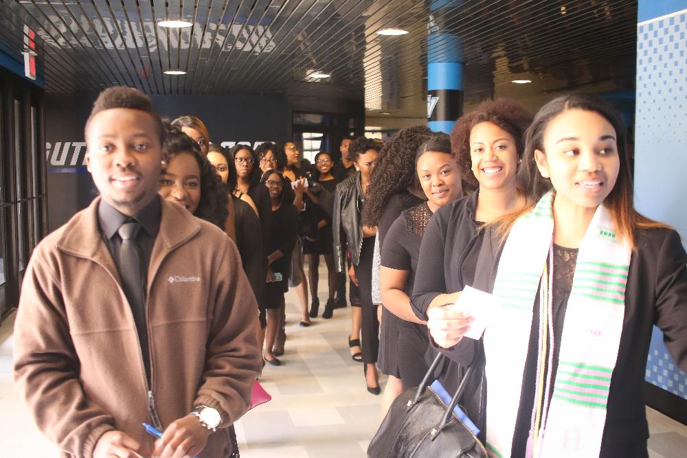 Black student graduates lining up